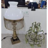 A mid 20th century lamp in the style of an oil lamp along with a green Venetian style wall light
