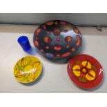 A Poole pottery studio charger, Delphis plate, and Aegeon plate, a West German retro vase, and an