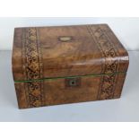 A Victorian walnut sewing box having parquetry inlay Location: