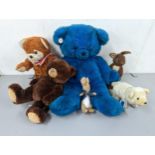 A group of soft toys to include a large vintage Russ blue teddy bear, a D.A.Toys example, Peter