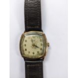 An Avia 9ct gold cased wristwatch on a leather strap Location: