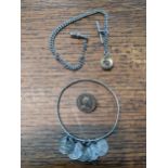 A silver watch chain with a silver collar compass, a coin brooch and bracelet Location: