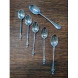 A set of five silver apostle teaspoons, and a rat tail teaspoon, 94g Location: