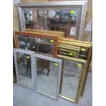 A quantity of 20th century wall mirrors to include a silver coloured framed mirror with bevelled