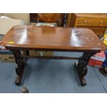 A Victorian mahogany side table, carved open fretwork trestle united by turned ends on bar bases and