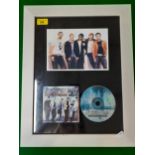 A 2014 framed Backstreet Boys montage containing a signed CD cover, a CD and a photograph, 28cm x