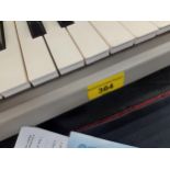 A Yamaha Portatone keyboard in padded travel case Location: RAF