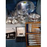 Silver plated tureens with lids, a silver plated twin handled, oval tray and boxed flatware
