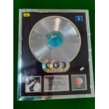 A framed presentation platinum award disc to Michael Jackson recognising worldwide sales of the