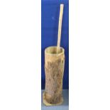 A rustic 20th century Turkish butter churn, made form a log with bark, 80cm high, 20cm dia, with a