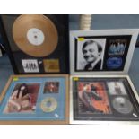 A group of framed montages to include a signed Lionel Ritchie 'Just For You' CD, a signed Cher