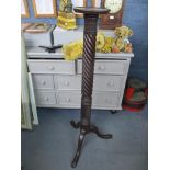A mahogany tripod plant stand, small circular top with moulded edge, on a wrythen turned and