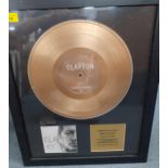 A framed Eric Clapton gold disc presented by Polydor recognising over 1 million worldwide recorded