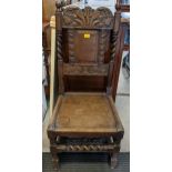 An early 20th century oak hall chair with carved ornament and barley twist columns Location: