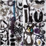 Mixed 20th Century costume jewellery to include vintage black faceted glass brooches, an amethyst