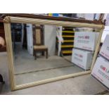 A modern large mirror having a moulded reeded frame and bevelled glass Location: