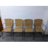 A group of four metal framed wickerwork conservatory chairs Location: