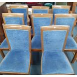 Two walnut carvers with blue chenille upholstered seats and backs together with six matching