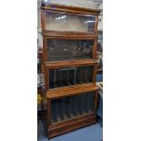 An early 20th century Globe Wernicke walnut four tier bookcase with single drawer below, 185.5cm h x