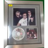 A 21st Century framed and signed photograph of the band queen (not including Freddie Mercury) and