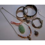 Costume jewellery to include a silver engraved bangle, a silver coloured necklace with coral, pearls