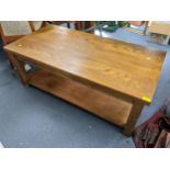 A modern oak rectangular two tier coffee table on black shaped legs, 45.5cm h x 120cm w Location: