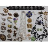 Vintage brooches and necklaces to include D'Orlan, clips and a 3 strand Aurora Borealis necklace