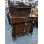 A Regency secretaire/chiffoniere with raised back, gadroon decorated shelf, flanked by ring turned
