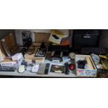 A mixed lot of computer, gaming and other electrical accessories to include a Magellan GPS 300