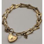 A 9ct gold V shaped link bracelet having a heart shaped clasp, total weight 6.3g Location: