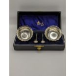 A boxed pair of silver salts hallmarked Birmingham 1905 with spoons, total weight 69.6g Location: