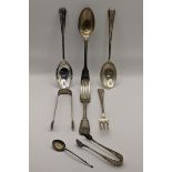 Silver flatware to include silver sugar tongs, hallmarked London 1802, a fiddle pattern shaped spoon