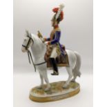 A German Rudolph Kammer Volkstedt porcelain figurine of a soldier entitled Trompeter 1814/1815