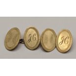 A pair of 9ct gold oval shaped cuff links having engraved initial detail, total weight 4.1g