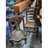 A late 19th/early 20th century ladder back chair on turned legs united by turned front stretcher and