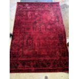 A contemporary machine woven red and black patterned rug 222cm x 152cm Location:A1B/RAB