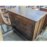 A late 19th century oak chest of two short and three graduated chest of drawers, copperized