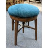 A circa 1900 revolving piano stool on block shaped legs Location: