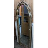 A contemporary gilt framed cheval wall mirror with moulded floral decoration 162cm x 56cm Location: