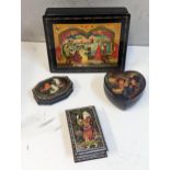 A group of four 20th century Russian boxes decorated with scenes to include Court scene and figures,