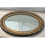 An early 20th century gilt moulded oval mirror Location: