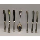 A silver fiddle pattern spoon, hallmarked London 1815, together with six silver knives, hallmarked