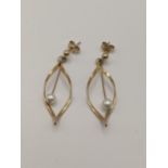 A pair of 9ct gold and pearl earrings Location: