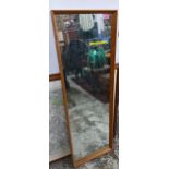 A mid-century retro teak framed wall mirror with rectangular plate glass, Design Centre London label