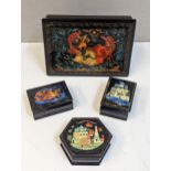 A group of four 20th century Russian boxes decorated with scenes to include Orthodox Buildings,