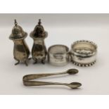 Mixed silver to include napkin rings, salts and sugar tongs, 149.7g Location: