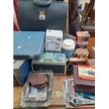 A vintage lot comprising a tin of old keys, display miniature bottles, a quantity of Ordnance Survey