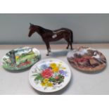 A Royal Doulton model of a brown stallion together with collectors plates.