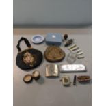 A mixed lot to include a 1930 bag, vesta case, penknives, a cigarette case, dressing table items,