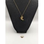 A 9ct gold Egyptian head pendant and chain, and a 9ct gold diamond and ruby set ring 5g Location: